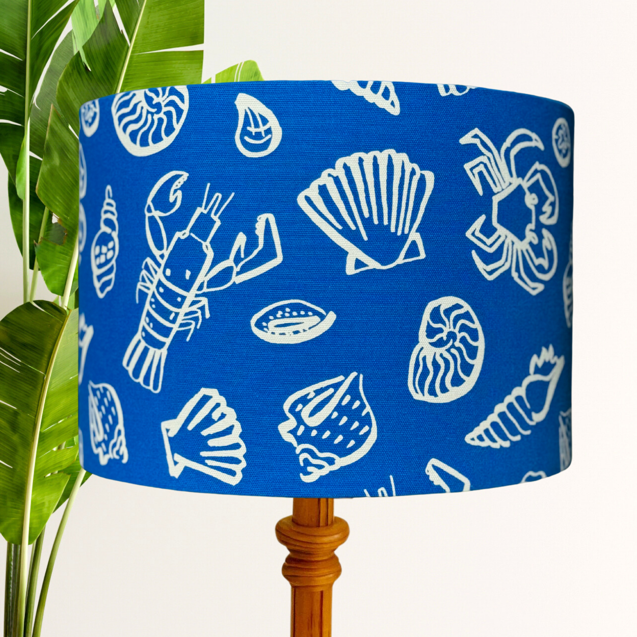 Shells on blue lampshade image 0